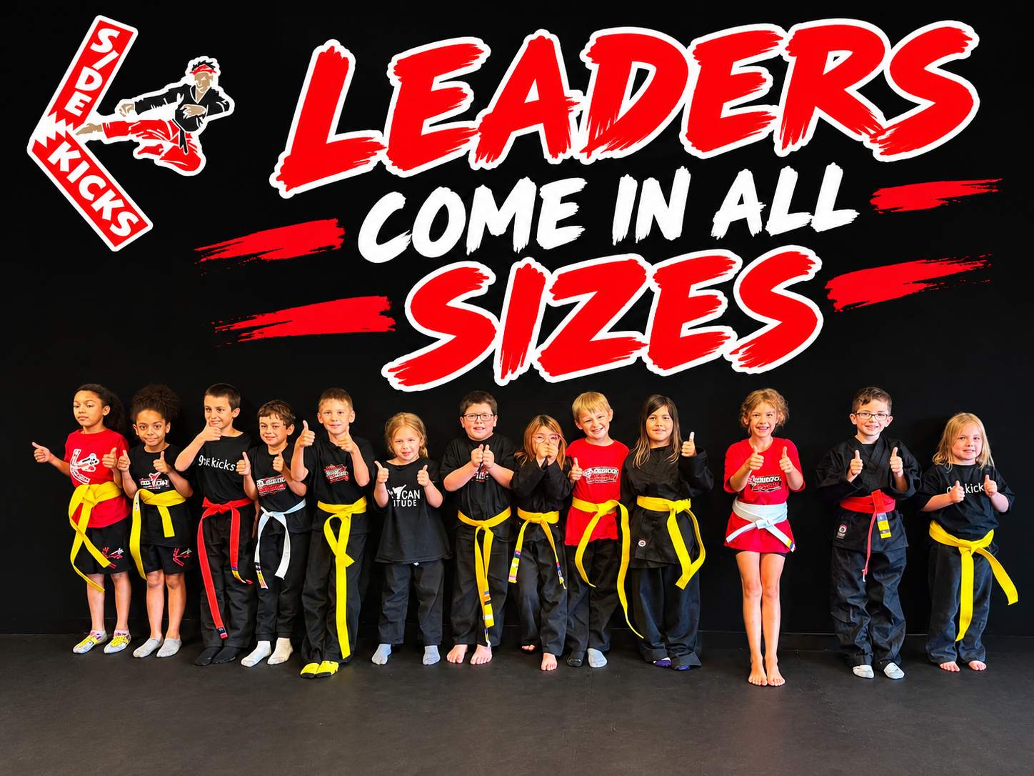 A line of Side Kicks Karate students giving thumbs up under the words LEADERS COME IN ALL SIZES