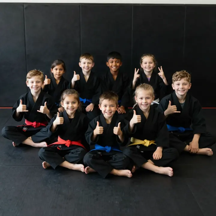 Side Kicks students smiling with thumbs up