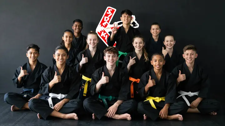 Side Kicks team group photo with all belts
